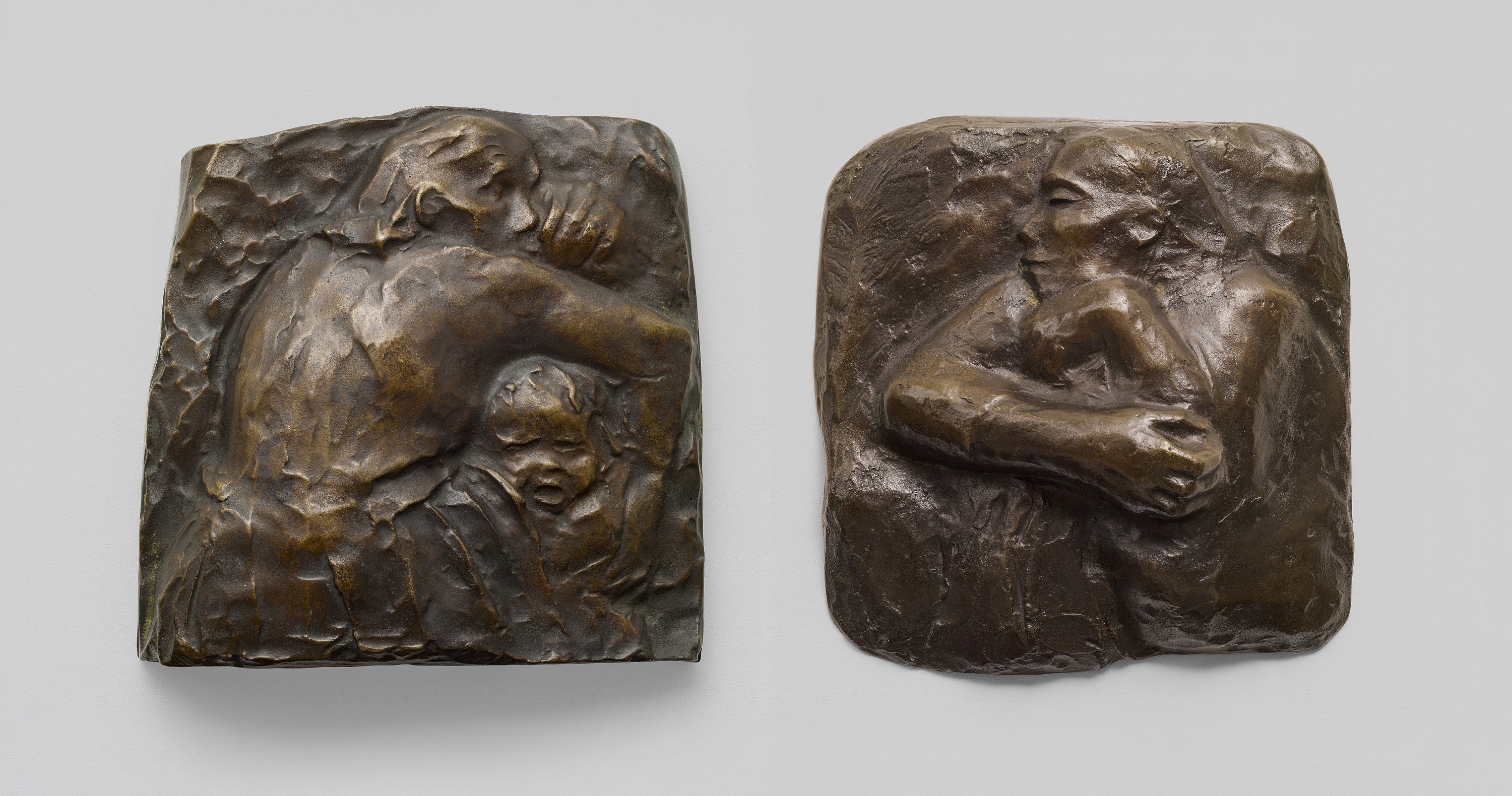 Käthe Kollwitz, Mother Protecting her Child I, model completed by October 1941 at the latest, cast probably 1951, bronze, 172 × 174 × 42.5 mm, Seeler 41 I.B.1., Kollwitz Museum Köln, Inv. Nr. 70100/86006 and Mother Protecting her Child II, model completed by October 1941 at the latest, cast probably 1951, bronze, 179 × 172 × 52.5 mm, Seeler 42 I.B.1., Kollwitz Museum Köln, Inv. Nr. 70100/86007 © Kollwitz Museum Köln, ph. Goldberg/Fuis.  